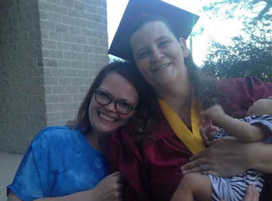 Megan at her graduation with Nicole and her grandchild